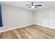 Bedroom featuring wood-look floors, ceiling fan, and neutral wall paint at 12 Big Buck Trl, Ormond Beach, FL 32174