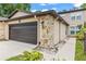 A beautifully maintained exterior shows a single-car garage and stone accents at 12 Big Buck Trl, Ormond Beach, FL 32174