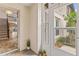 Charming front porch with tiled floor, a storm door, and access to the main house at 12 Big Buck Trl, Ormond Beach, FL 32174