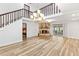 Spacious living area features a stone fireplace, wood floors, and access to the lanai at 12 Big Buck Trl, Ormond Beach, FL 32174