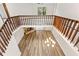Aerial view showcasing the open living room, stone fireplace, and balcony at 12 Big Buck Trl, Ormond Beach, FL 32174