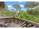Patio featuring brown wood deck with view of trees at 12 Big Buck Trl, Ormond Beach, FL 32174