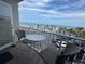Cozy balcony view showcasing the pool, beach and ocean under a beautiful partly cloudy blue sky at 1233 S Atlantic Ave # 3070, Daytona Beach, FL 32118