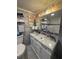 Bright bathroom features a marble countertop, modern fixtures, and artistic decor at 1233 S Atlantic Ave # 3070, Daytona Beach, FL 32118
