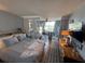 Bedroom boasts natural light, beach view, and serene interior design at 1233 S Atlantic Ave # 3070, Daytona Beach, FL 32118