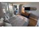 Inviting bedroom featuring a TV, beach decor, and wood-look flooring at 1233 S Atlantic Ave # 3070, Daytona Beach, FL 32118