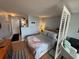 Cozy bedroom featuring a room divider, wood-look flooring, and ample closet space at 1233 S Atlantic Ave # 3070, Daytona Beach, FL 32118
