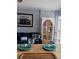 Cozy dining area with tableware set for a meal and a view of the living room at 1233 S Atlantic Ave # 3070, Daytona Beach, FL 32118