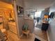 Inviting entryway with tile floors, artwork, and a glimpse into the living area and bathroom at 1233 S Atlantic Ave # 3070, Daytona Beach, FL 32118