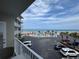 Wonderful view showcasing the pool, palm trees, beach and ocean under a beautiful partly cloudy blue sky at 1233 S Atlantic Ave # 3070, Daytona Beach, FL 32118