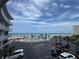 Scenic view showcasing the pool, palm trees, beach and ocean under a beautiful partly cloudy blue sky at 1233 S Atlantic Ave # 3070, Daytona Beach, FL 32118