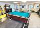 Bright game room features a pool table, arcade games, and seating area at 1233 S Atlantic Ave # 3070, Daytona Beach, FL 32118