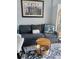 Comfortable living room featuring a blue sofa, patterned rug, and decorative pillows at 1233 S Atlantic Ave # 3070, Daytona Beach, FL 32118