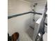 Bright tiled shower with pebble floor, modern fixtures, and a partial glass enclosure at 1233 S Atlantic Ave # 3070, Daytona Beach, FL 32118