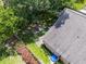 Aerial backyard view featuring a privacy fence and some beautiful flower bushes at 25216 Ironwedge Dr, Sorrento, FL 32776
