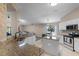 Well-lit kitchen with granite counters, stainless appliances, and island, open to living area at 25216 Ironwedge Dr, Sorrento, FL 32776