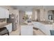 Bright kitchen features granite countertops, stainless steel appliances, an island, and tiled floors at 25216 Ironwedge Dr, Sorrento, FL 32776