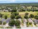 Lovely street view showcasing verdant trees, well-kept lawns, and beautiful houses at 25216 Ironwedge Dr, Sorrento, FL 32776