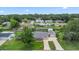Aerial view of the property showcasing the home, driveway, and surrounding neighborhood at 321 Scotland Dr, Daytona Beach, FL 32117