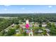 This property includes a screened pool, a large, fenced backyard, and lush trees at 321 Scotland Dr, Daytona Beach, FL 32117
