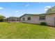 Large grassy backyard with lush landscaping and beautiful home exterior at 321 Scotland Dr, Daytona Beach, FL 32117