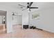 Bright bedroom with neutral paint, ceiling fan, closet, and tile flooring for a clean and modern feel at 321 Scotland Dr, Daytona Beach, FL 32117