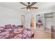Bedroom featuring tile floors, ceiling fan, and closet adding functionality and style to the space at 321 Scotland Dr, Daytona Beach, FL 32117