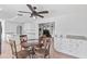 Open-concept dining area with granite counters and white cabinets at 321 Scotland Dr, Daytona Beach, FL 32117