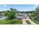 Charming single-story home with a well-maintained front yard and long driveway at 321 Scotland Dr, Daytona Beach, FL 32117