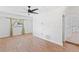 Open living room features wood-look tile flooring and leads to the updated kitchen area at 321 Scotland Dr, Daytona Beach, FL 32117