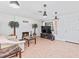 Comfortable living room with fireplace, tile flooring, and ample lighting fixtures at 321 Scotland Dr, Daytona Beach, FL 32117