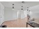 Spacious living area offers ample lighting, tile floors, and a seamless flow into the dining space at 321 Scotland Dr, Daytona Beach, FL 32117