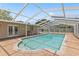 Outdoor screened pool area with a large backyard and white pergola at 321 Scotland Dr, Daytona Beach, FL 32117