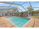 Outdoor screened pool area with a large backyard and white pergola at 321 Scotland Dr, Daytona Beach, FL 32117