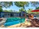 Aerial view of a private backyard featuring a pool, gazebo, and outdoor seating at 35 Whippoorwill Ln, Ormond Beach, FL 32174