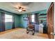 Bedroom offering natural light, ceiling fan, and closet for storage at 35 Whippoorwill Ln, Ormond Beach, FL 32174