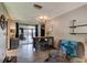 Open dining area with a modern chandelier, table with seating, and sliding glass doors to the outdoors at 35 Whippoorwill Ln, Ormond Beach, FL 32174