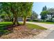 Charming home with a well-manicured lawn and mature trees at 35 Whippoorwill Ln, Ormond Beach, FL 32174