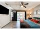 Spacious main bedroom with a ceiling fan and access to the lanai at 35 Whippoorwill Ln, Ormond Beach, FL 32174