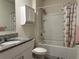 Bathroom featuring vanity with granite top, tub and shower combo and storage cabinet at 551 Shaelyn Pl, Deland, FL 32724