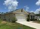 Charming single Gathering home with a well-manicured lawn and a two car garage at 551 Shaelyn Pl, Deland, FL 32724