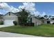 Charming single Gathering home with a well-manicured lawn and a two car garage at 551 Shaelyn Pl, Deland, FL 32724