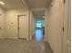 Hallway featuring neutral paint, ceramic tile floor and several access doors at 551 Shaelyn Pl, Deland, FL 32724