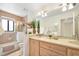 Well-lit bathroom with a double vanity, large mirror, and a shower/tub combination with tiled walls at 1 Crooked Bridge Way, Ormond Beach, FL 32174
