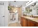 Bathroom with tiled shower, granite countertop, and vanity at 1 Crooked Bridge Way, Ormond Beach, FL 32174