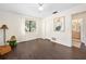 Bright, airy bedroom with wood floors, a ceiling fan, and a window view with lots of natural light at 1 Crooked Bridge Way, Ormond Beach, FL 32174