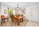 Bright dining room with large arched window, showcasing a refined space for dining at 1 Crooked Bridge Way, Ormond Beach, FL 32174