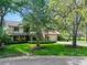 Charming two-story home with a manicured lawn and mature trees providing shade at 1 Crooked Bridge Way, Ormond Beach, FL 32174