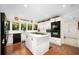 Modern kitchen with an island cooktop and sleek black appliances, creating a chef's dream at 1 Crooked Bridge Way, Ormond Beach, FL 32174