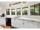 Bright kitchen showcasing a double sink, ample cabinetry and counter space, perfect for culinary creations at 1 Crooked Bridge Way, Ormond Beach, FL 32174